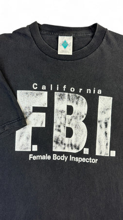 Vintage Tour Champ T-Shirt 90s "FBI Female Body Inspector" Made in El Salvador Schwarz L